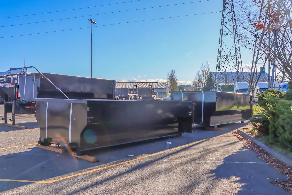 Roll-off dumpster ready for waste disposal at job site for Concrete Dumpster Rental in Gaines